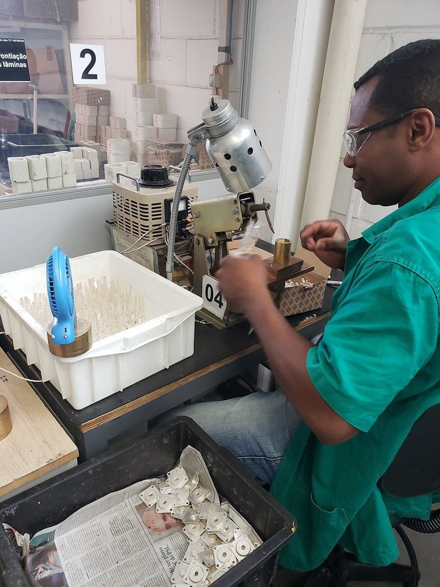 A DENCO technician assembling fuse elements at the bench